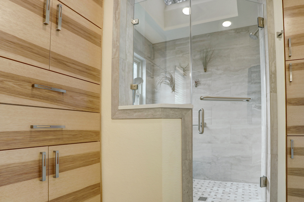 Brannon Cove shower entrance with tile returns and a mosaic floor