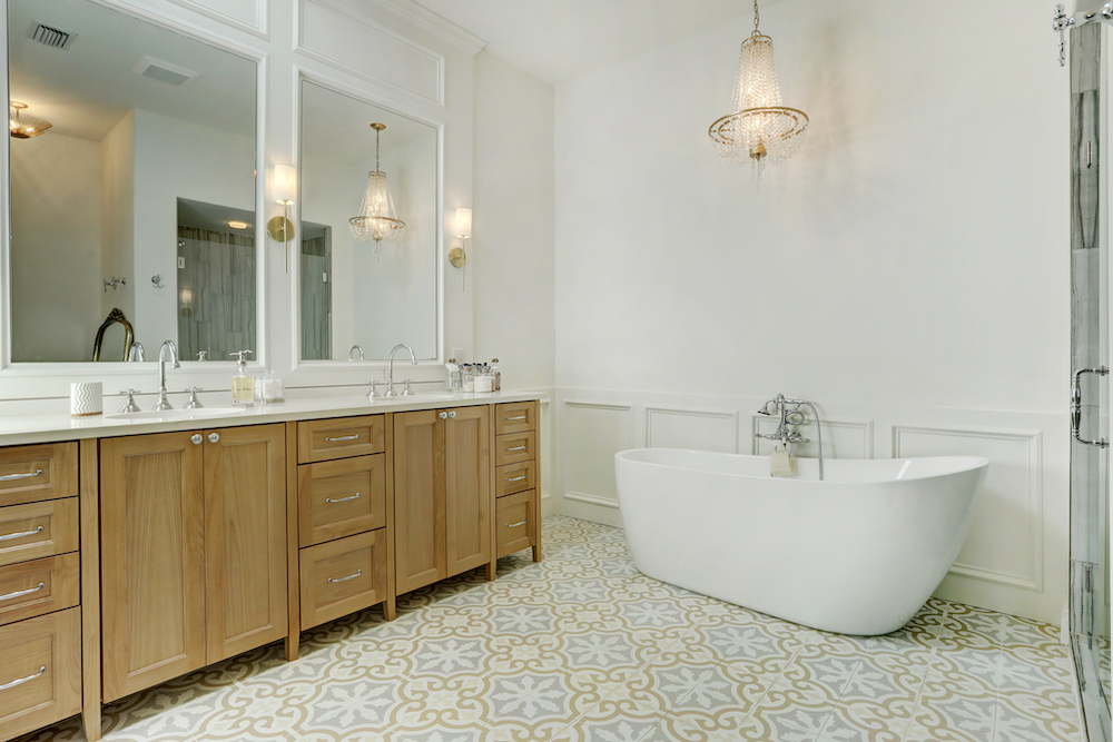 Colorado Crossing bathroom with patterned floor tile and a freestanding bathtub