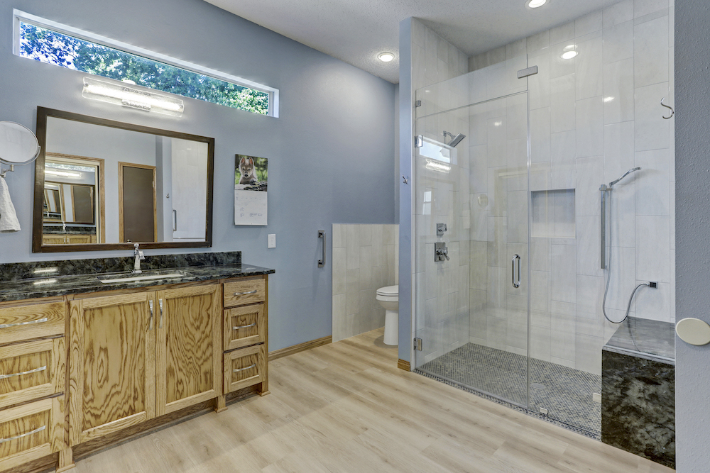 Spring Wagon bathroom with a broad view of the tiled shower and niche